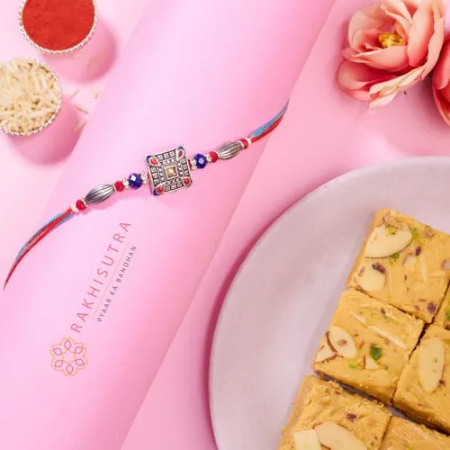 Radiant AD Rakhi and Sweet Soan Papdi Combo