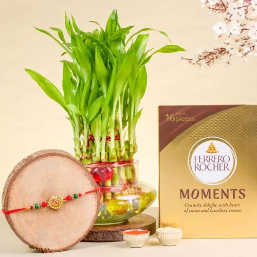 Serene OM Rakhi with Treats  N  Lucky Bamboo Trio